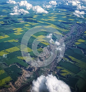 Red deer river in Alberta Canada.Fields of canola and other agronomic crops photo