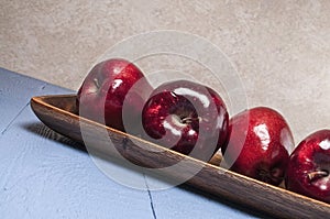 Red delicious,apples,blue wood table