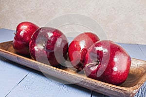 Red delicious,apples,blue wood table