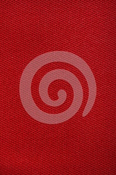 Red denim jeans texture close up. Red denim jeans background