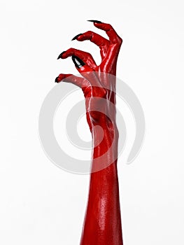 Red Devil's hands with black nails, red hands of Satan, Halloween theme, on a white background, isolated