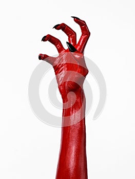 Red Devil's hands with black nails, red hands of Satan, Halloween theme, on a white background, isolated