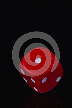 Red dice on the black background