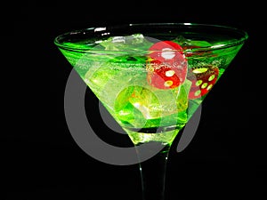 Red dice in a cocktail glass on black background. casino series