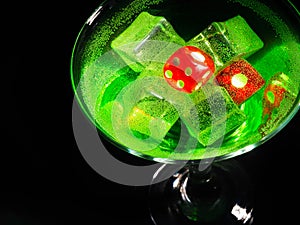 Red dice in a cocktail glass on black background. casino series