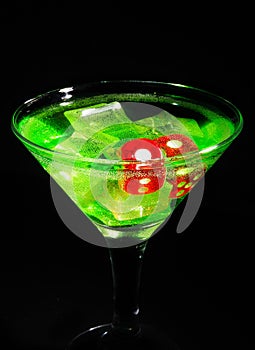 Red dice in a cocktail glass on black background. casino series