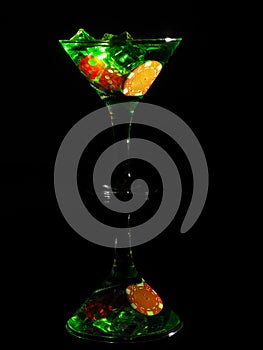 Red dice in a cocktail glass on black background. casino series