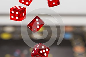 Red dice on dark background, concept of risk, gambling and chance.