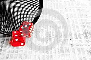 Red dice on the financial newspaper