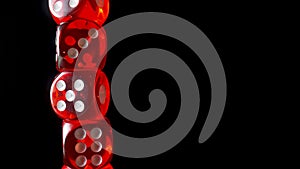 Red dice spinning on an isolated black background. Red cube, craps close up. Gambling background. Space for text or