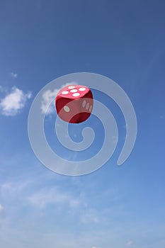 Red dice suspended in the SKY