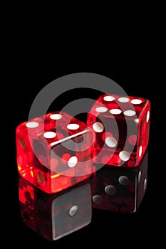 Red dice on transparent black background