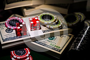 Red dices on chip and dollar bills, casino concept