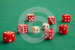 Red dices on green poker gaming table in casino. Concept online gambling