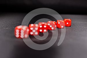 Red dices in a row