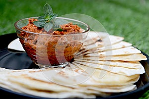 Red dip with tortilla