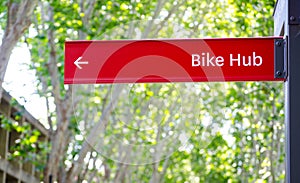 Red Direction sign for bike hub.