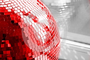 Red Disco ball. Mirror ball. Concept of a night club party, club life.