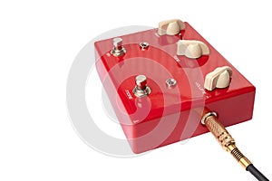 Red distortion guitar pedal isolated