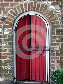 Red Door behind Iron Gate