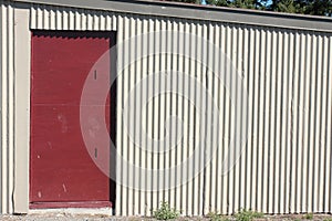 Red door in corrugated iron shed