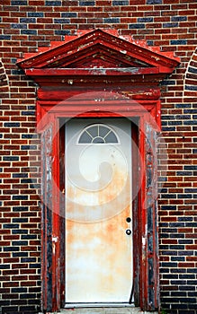 Red Door With Cracked Paint and Broken Frame