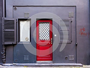 The red door and the gray wall