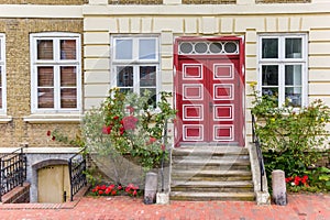 Red door at a historic house in Gluckstadt