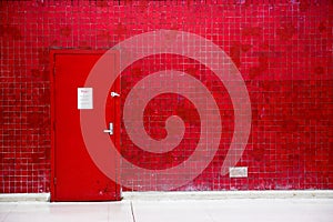 Red door and mosaic wall