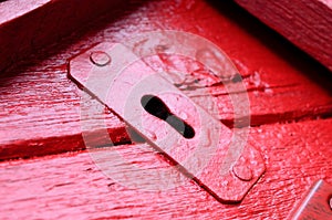 Red door with old key hole macro