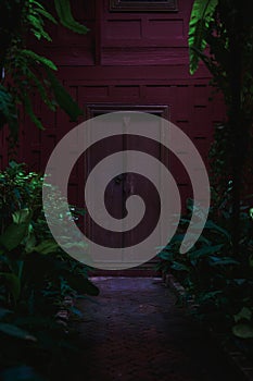 Red door of Thai traditional house in Bangkok