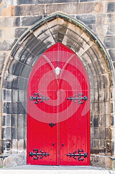 Red door to old church in Scotland