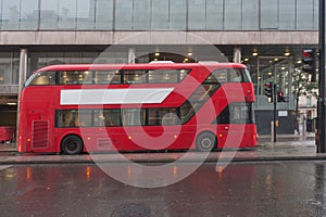 Red double decker bus on Pall Mall street in London photo