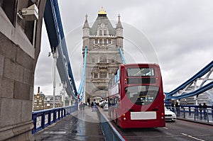 Red doubledecker bus on Tower Bridge, London, UK