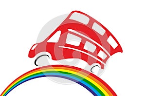 Red doubledecker rides by rainbow photo