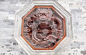Red dragon carving on wall