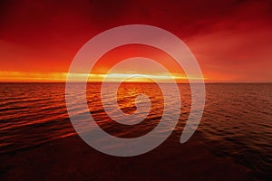 Red dramatic sky over the sea at sunset