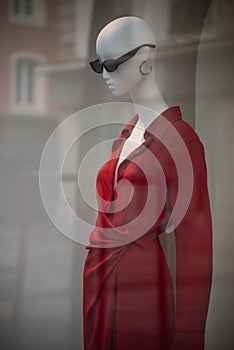 red dress on mannequin in a fashion store showroom