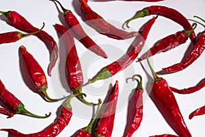 Red dried chilli peppers on a white background