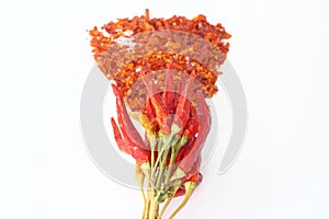 Red dried crushed hot chili peppers and chili flakes or powder isolated on white background, healthy turkish spice