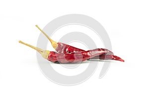 Red dried crushed hot chili peppers isolated on white background