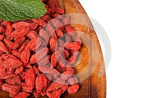 Red dried goji berries in a plat photo