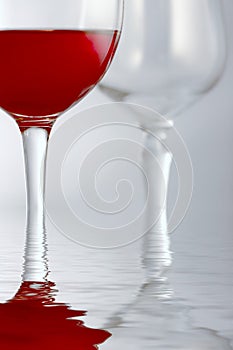 Red drink in glass in water