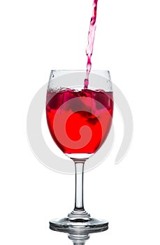 Red drink with ice cubes in a glass, Red soda in glass wine.