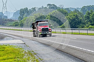 Red Dump Truck On Access Road