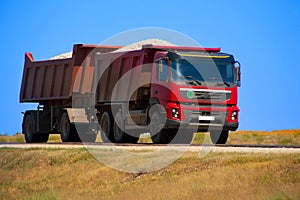 Red dump truck with the trailer