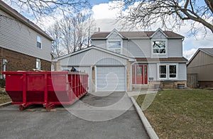 Red Dumpster Bin on the Driveway of a Suburban House #1