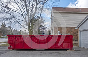 Red Dumpster Bin on the Driveway of a Suburban House #2