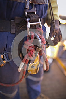 The red dynamic nylon ropes, fasten with figure of eights knot attaching, secure into Aluminium rope access safety descender photo