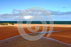 Red earthed estuary and ocean at Carnarvon